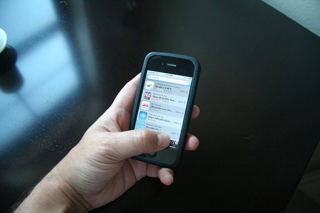 Person using health and wellness apps on a smartphone