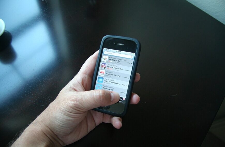 Person using health and wellness apps on a smartphone